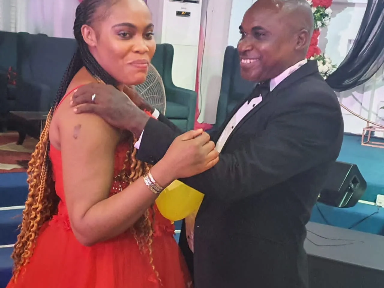 A husband and wife smiling together at the Couples Valentine Dinner