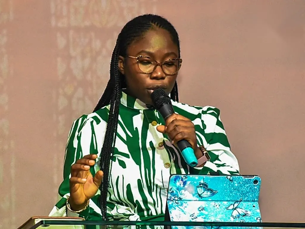 The leader of Petra Youth Church speaking from the pulpit