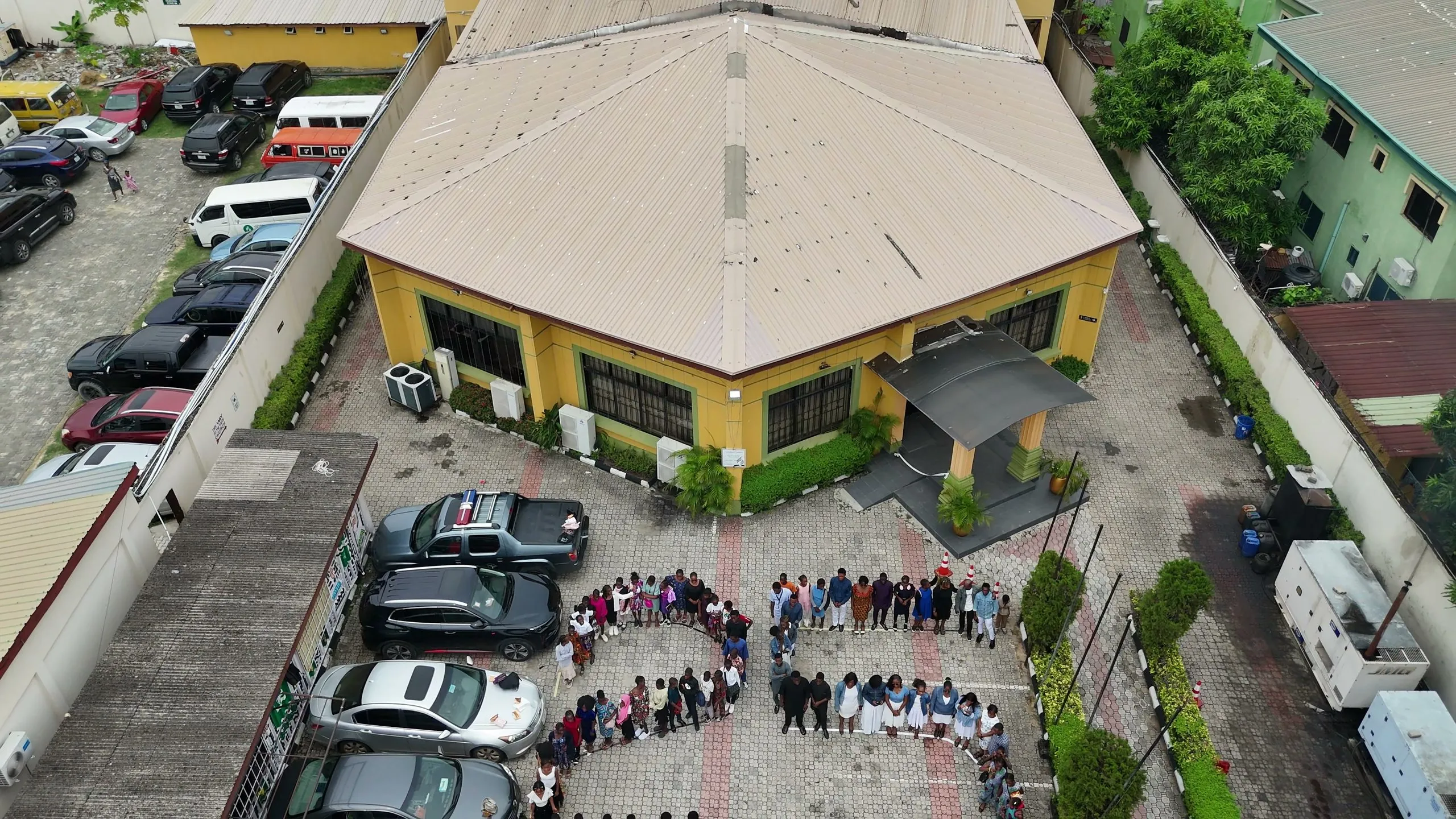 The Victory Sanctuary building in Lekki seen from above, with members gathered in the grounds