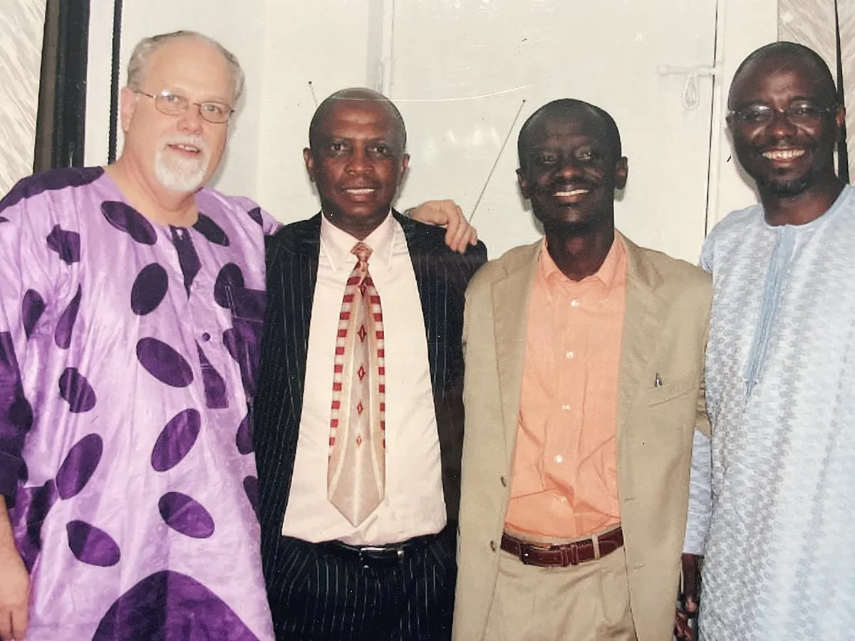 Ministers and a guest speaker smiling together