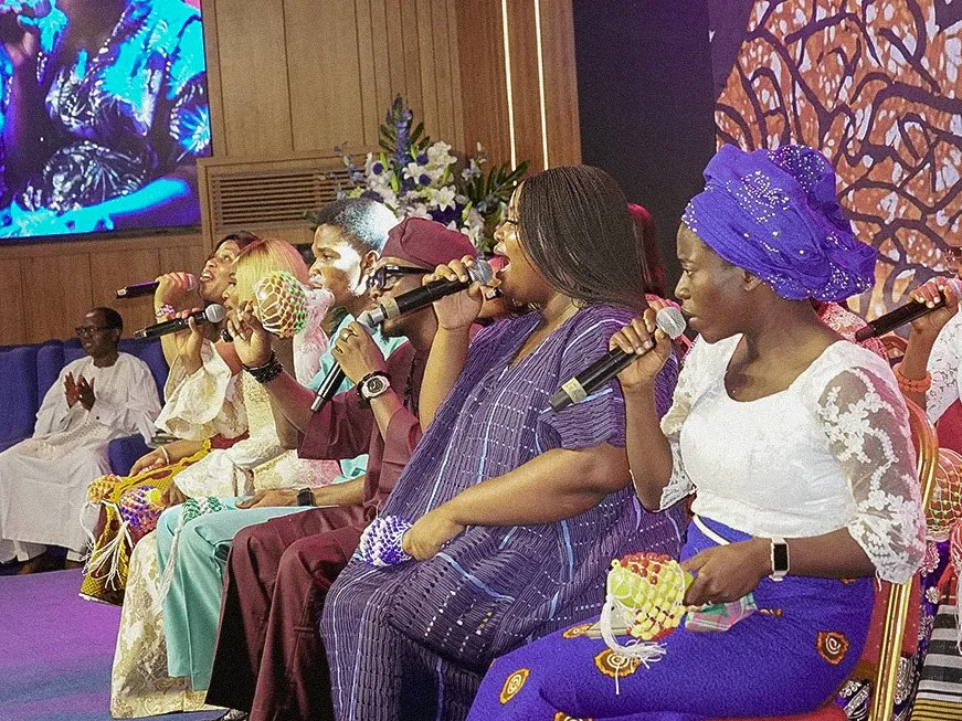 Women of the Yabonupe choir singing in traditional attire